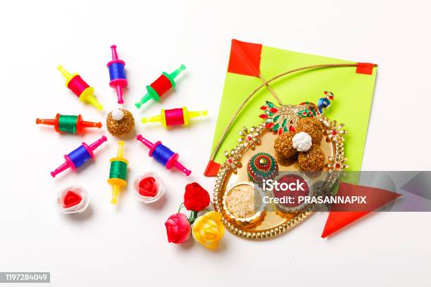 Indian Festival Makar Sankranti Concept Kite String With Sesame Seed Ball Or Til Ke Laddo Stock Photo - Download Image Now
