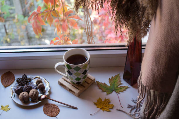 istock Breakfast with coffee and snacks on the window sill. 1197284449