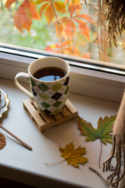 istock Breakfast with coffee and snacks on the window sill. 1197284463