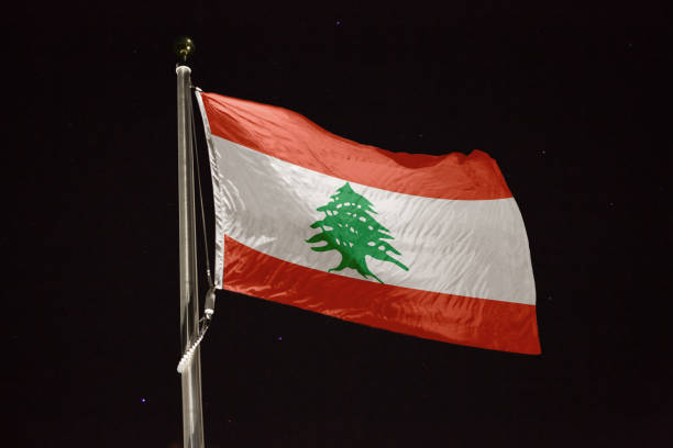istock Lebanon flag blowing in the wind at night 1197285187