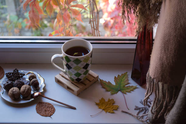istock Breakfast with coffee and snacks on the window sill. 1197285375