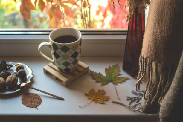 istock Breakfast with coffee and snacks on the window sill. 1197285419