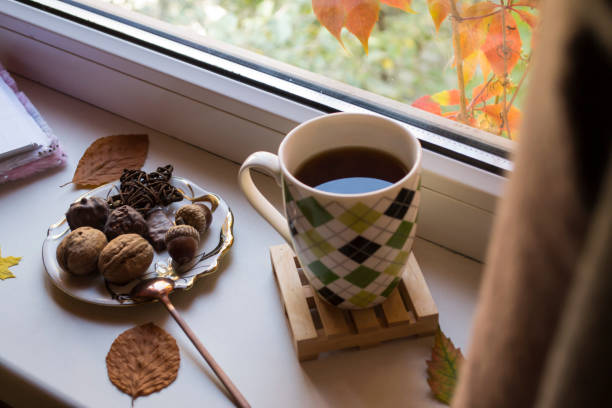 istock Breakfast with coffee and snacks on the window sill. 1197285423