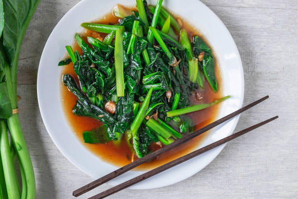 istock Fried Kale with Oyster Sauce menu on wooden table 1197285556