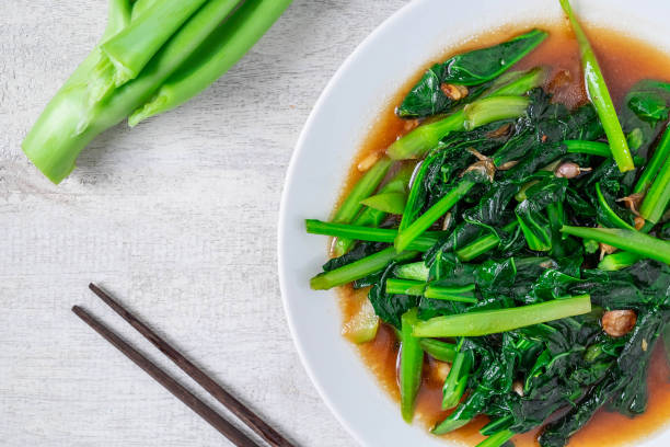 istock Fried Kale with Oyster Sauce menu on wooden table 1197285558