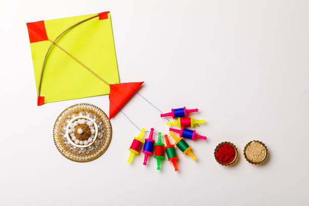 istock Indian festival makar sankranti concept, sesame seed ball or til ke laddo and tilgul with colorful paper kite 1197285607