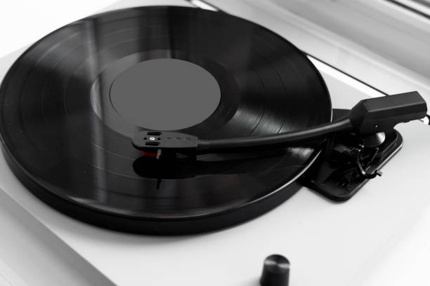 istock Vinyl turntable on a white background. Retro audio equipment for vinyl disk. 1197286433