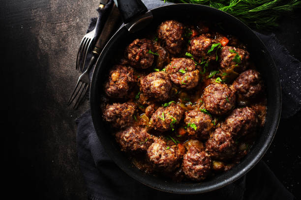 istock Fried meatballs with sauce on pan 1197288169