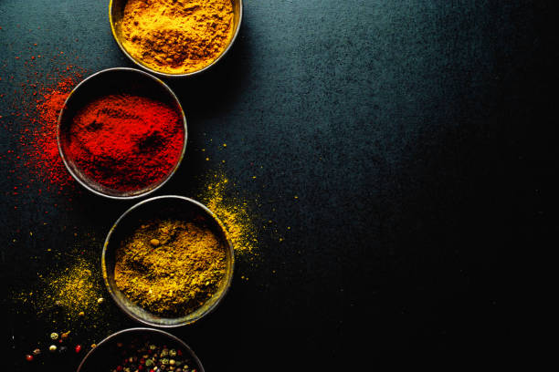 istock Colorful spices on dark background 1197288194