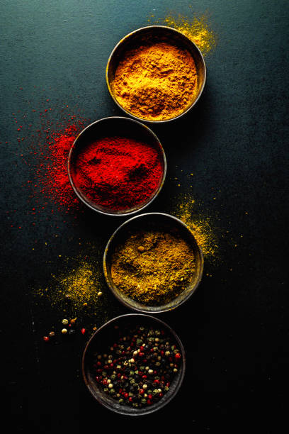 istock Colorful spices on dark background 1197288257