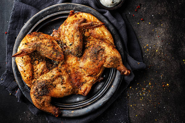 tabaka di pollo al forno con spezie - barbecue chicken foto e immagini stock