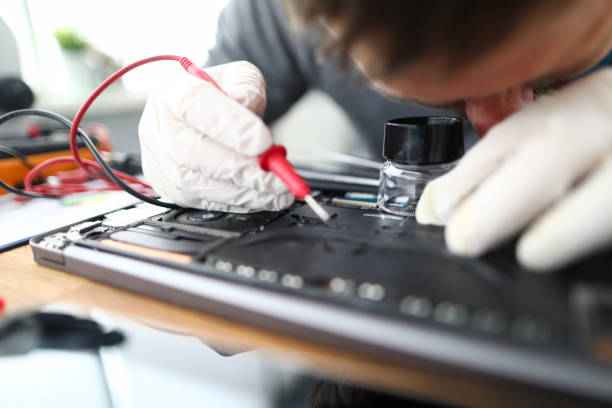 istock Man soldering laptop parts 1197289531