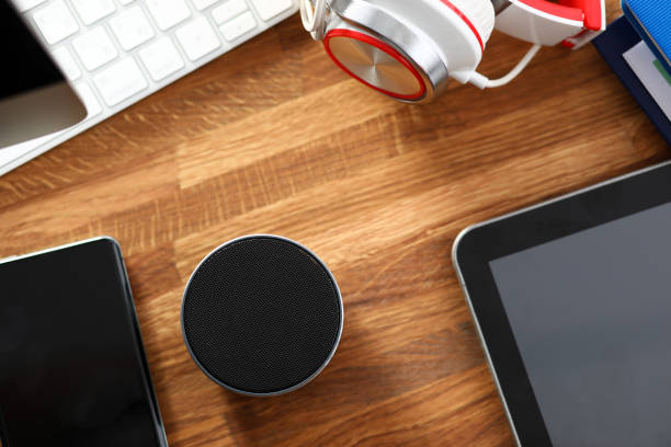 Set of media gadgets lying at table surface close-up