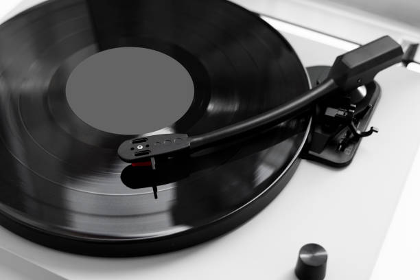 istock Vinyl turntable on a white background. Retro audio equipment for vinyl disk. 1197289573