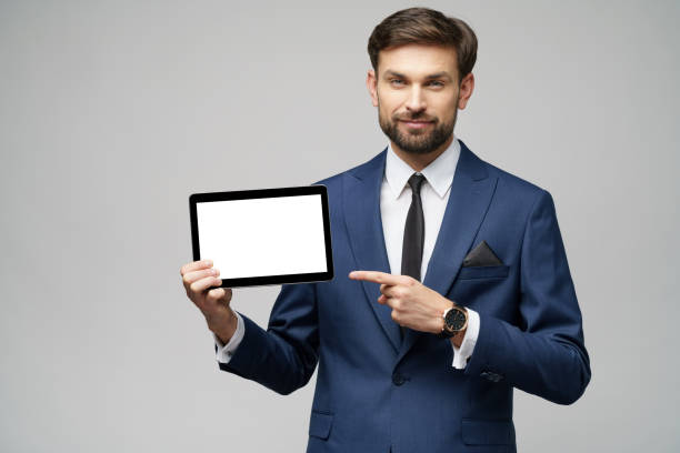 istock Young Businessman presenting digital tablet pc pad with blank screen 1197289601