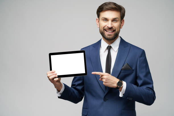 istock Young Businessman presenting digital tablet pc pad with blank screen 1197289616