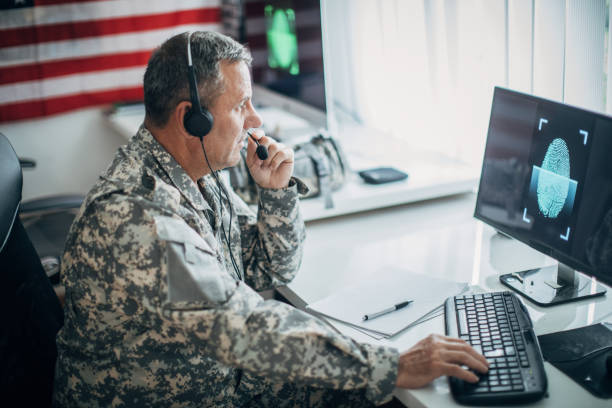 istock An old soldier sitting in an office uses a headset and a microphone 1197289891