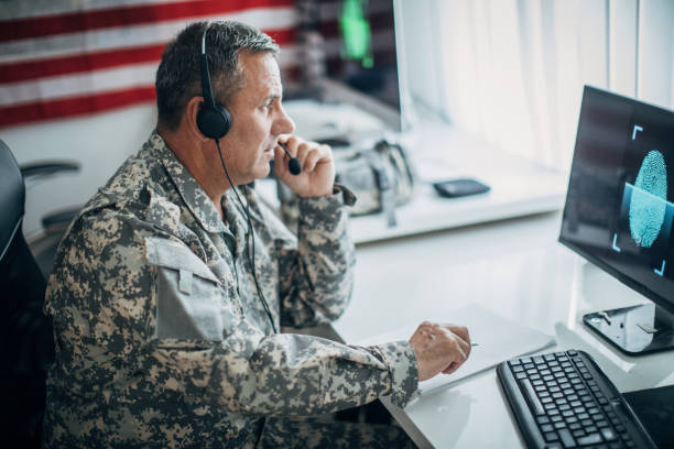 istock An old soldier sitting in an office uses a headset and a microphone 1197289945