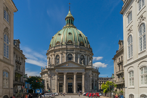 Copenhagen, Denmark - June 30th, 2015: The majestic Frederik's Church with it's impressive dome, also known as the Marble Church, forms with its rococo architecture a central point of the Frederiksstaden district.