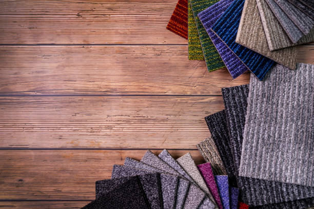 istock floor carpet samples on brown wooden background with copy space 1197294840