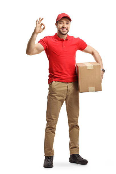 istock Delivery man with a package gesturing a great sign 1197296999