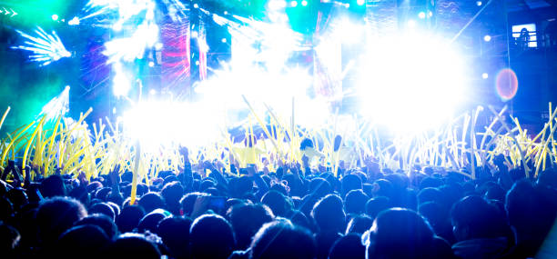 istock Concert arena with fans clapping 1197297030