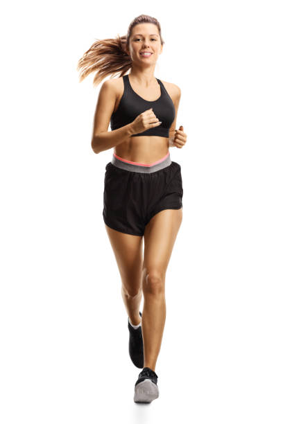 istock Young woman in shorts running 1197297067
