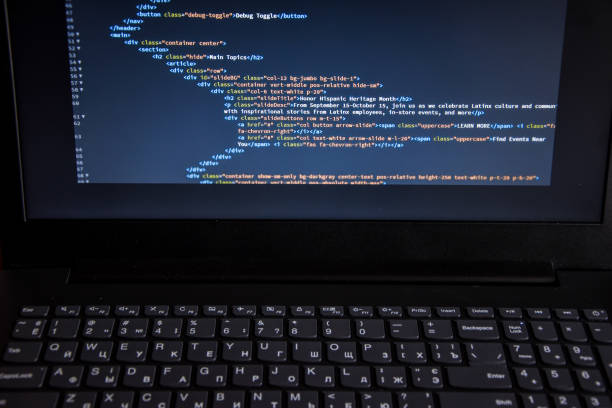Close up css HTML code on monitor screen with black background Source code or HTML code on screen of laptop, keyboard. Close up css code on monitor screen with black background, binary code on dark background hypertext stock pictures, royalty-free photos & images