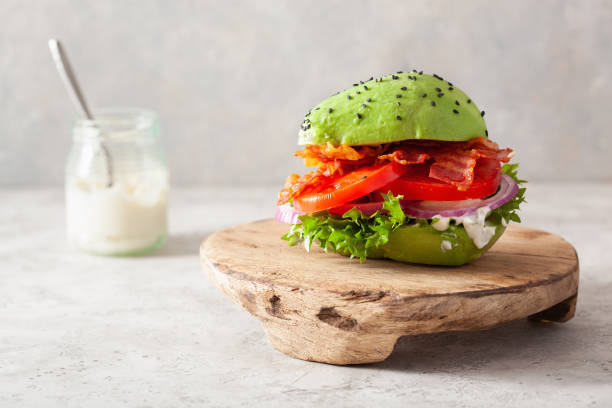 istock keto paleo diet avocado burger with bacon, lettuce, tomato 1197298365