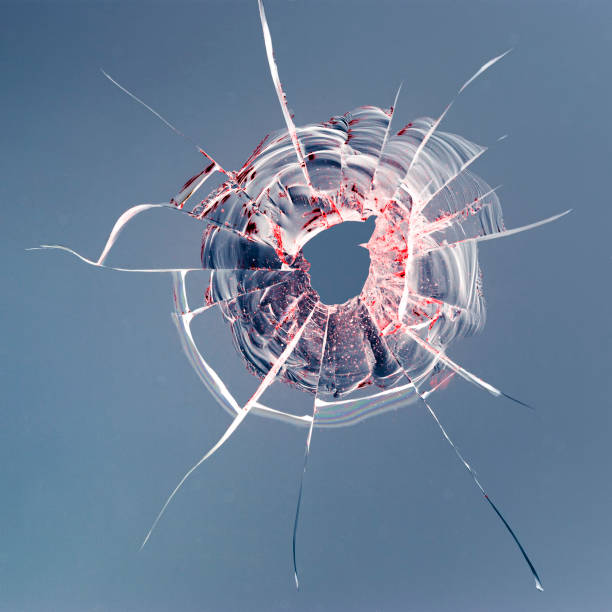 istock glass crack after window destruction on soft blue background 1197299237
