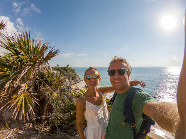 istock Young couple taking selfie portrait in Tulum archeological zone 1197299769