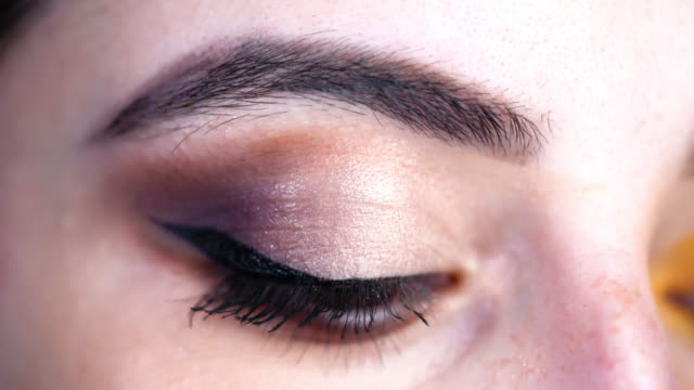 Close-up of girl's eye, make-up. stock video