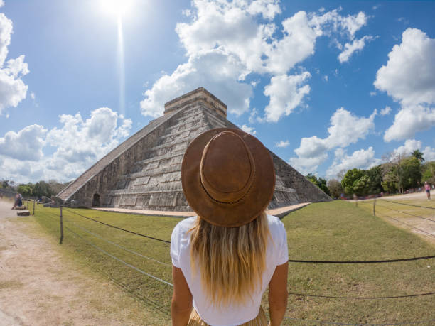 istock Travel girl contemplating Chichen Itza pyramid, Mexico 1197303336