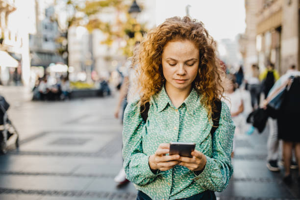 istock Lonely girl walking around town 1197305542