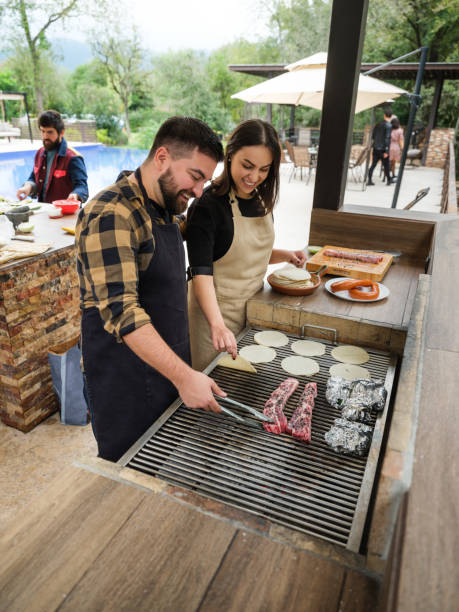 istock Young people grilling in patio 1197306613