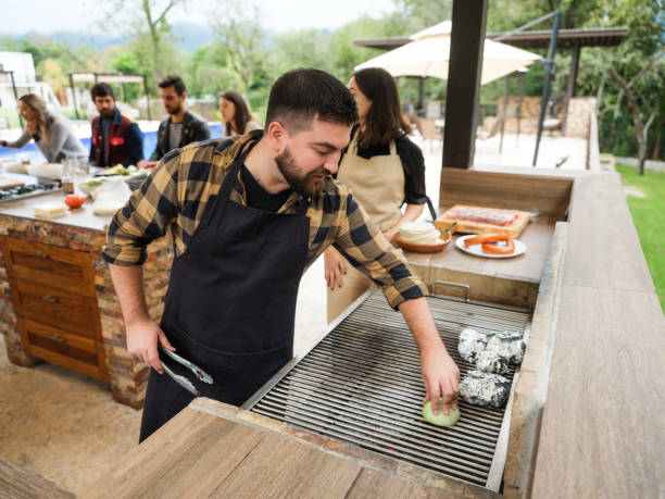 istock Latin friends having fun grilling 1197306615