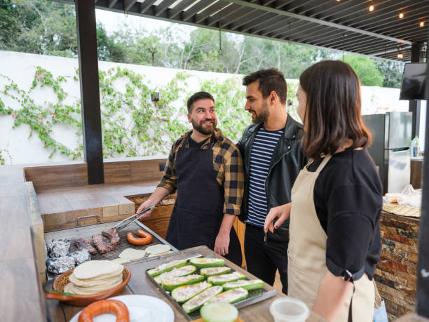 istock Latin friends grilling and talking 1197306630
