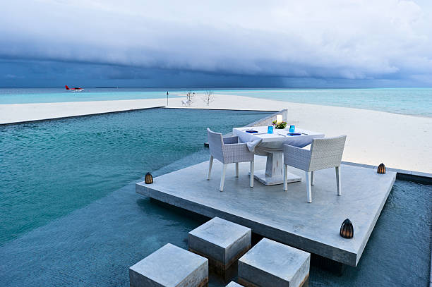 istock dining table on the deck of outdoor swimming pool 119730802