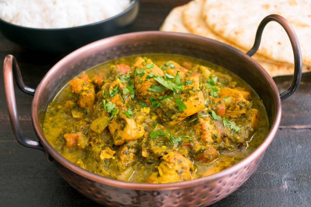 istock Indian Tomato-Cilantro Chicken Served with Naan Bread and Basmati Rice 1197308143