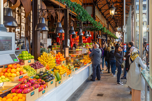 Madrid,Spain 12/26/2019 Mercado de San Miguel (San Miguel Market) in central Madrid is a covered market where stunning architecture and beautiful food come together. Various kind of food is being sold