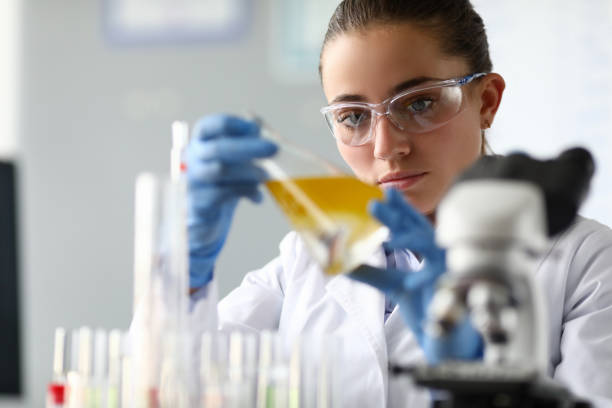istock Concentrated female in white coat 1197310973