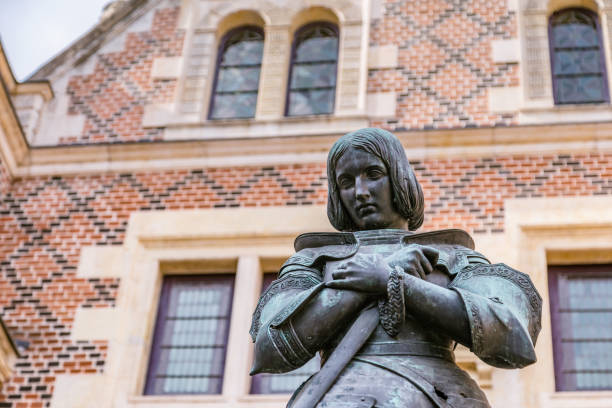 Statue of Jeanne D arc in front of Hotel Groslot , in use as town hall in Orleans France