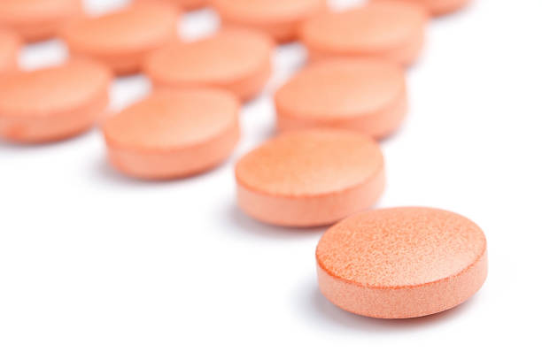 istock Follow leader - orange pills close-up 119731373