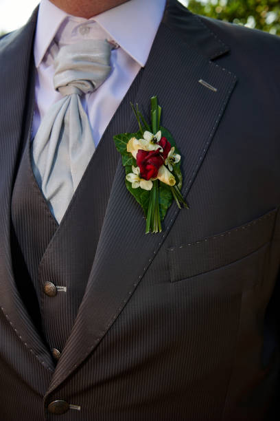 istock groom with buttonhole rose decoration 1197315219