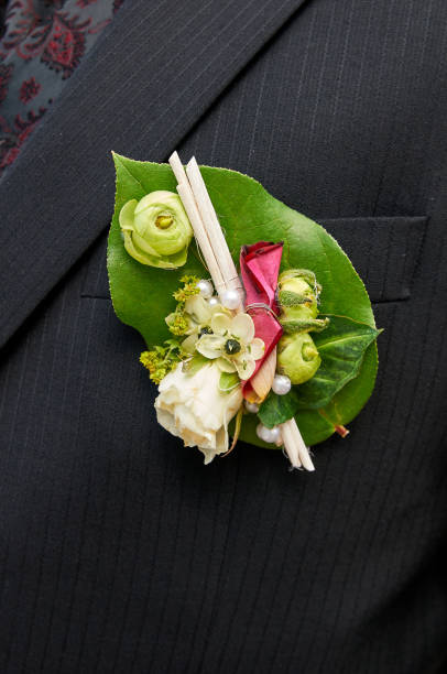 istock groom with buttonhole rose decoration 1197316383
