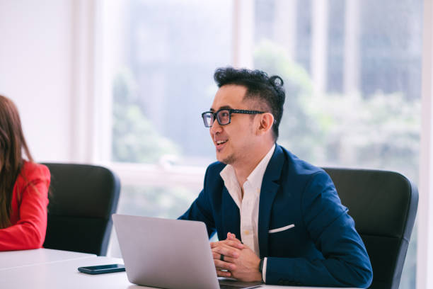 istock Young Businessman Having a Discussion in a Meeting Room 1197320436