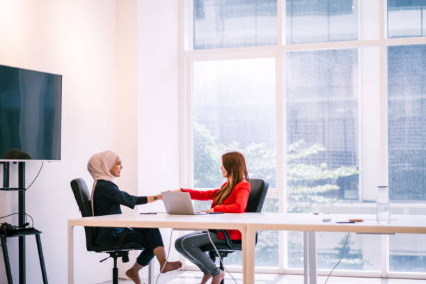 istock Two Beautiful Businesswomen Handshake 1197320445