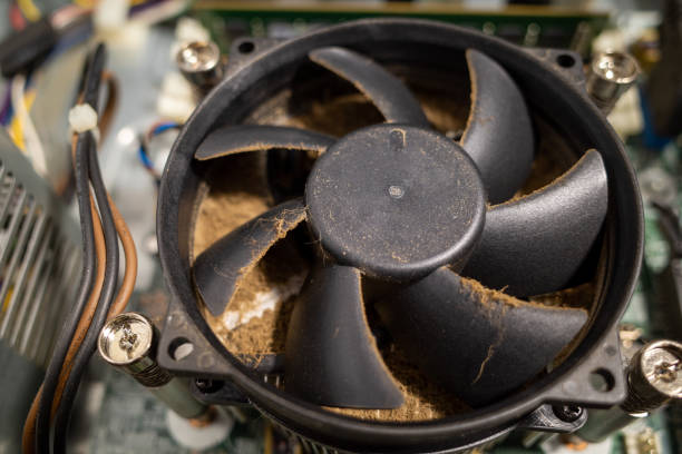 istock a very dirty computer fan inside a computer is cleaned by a vacuum cleaner 1197321842