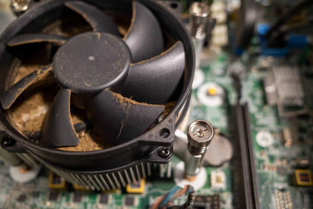 istock a very dirty computer fan inside a computer is cleaned by a vacuum cleaner 1197321845