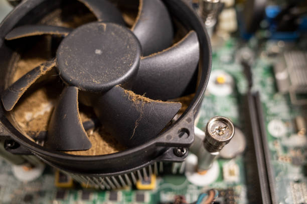 istock a very dirty computer fan inside a computer is cleaned by a vacuum cleaner 1197321848